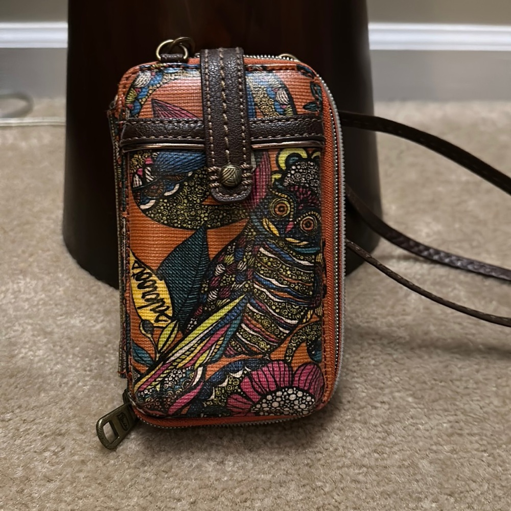 Sakroots cell phone and credit card cross body bag.